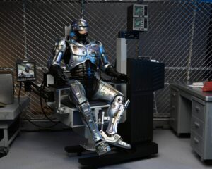 RoboCop Figura Ultimate Battle Damaged RoboCop with Chair
