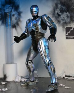 RoboCop Figura Ultimate Battle Damaged RoboCop with Chair