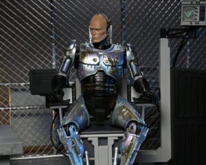 RoboCop Figura Ultimate Battle Damaged RoboCop with Chair