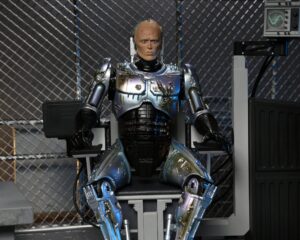 RoboCop Figura Ultimate Battle Damaged RoboCop with Chair