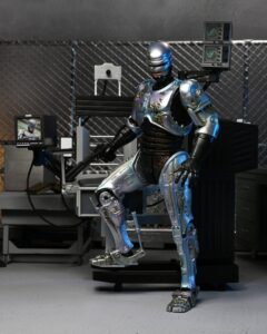 RoboCop Figura Ultimate Battle Damaged RoboCop with Chair